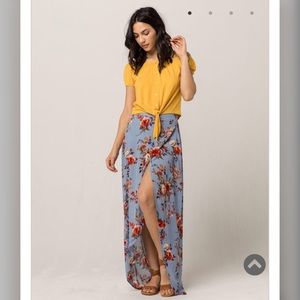 Yellow front tie crop top and floral maxi skirt